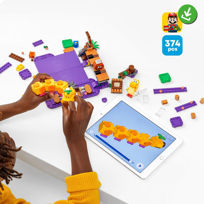 Child assembling LEGO® Super Mario Poison Swamp Expansion Set 71383 with interactive app and bricks.