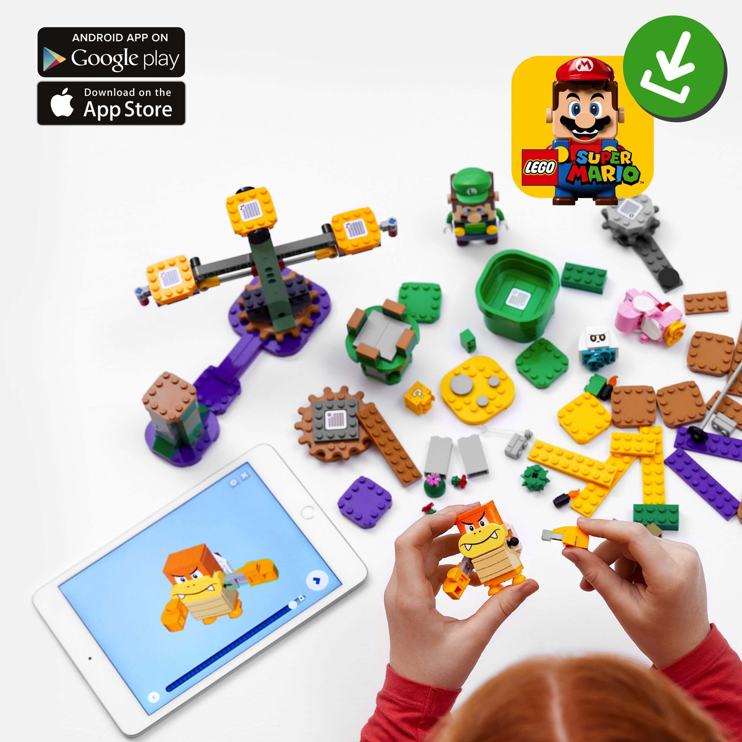 Child playing with LEGO® Super Mario 71387 Starter Course, showcasing interactive building with LEGO® Luigi and app integration.