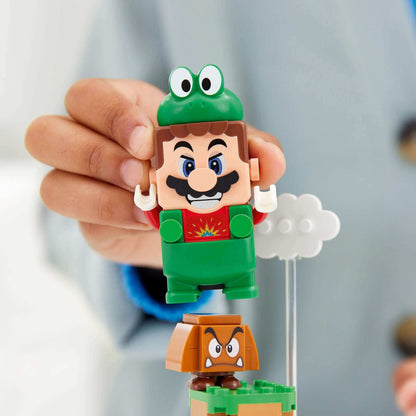 Child holding LEGO® Super Mario Frog Mario figure in frog suit, ready for adventures with a Goomba and cloud.