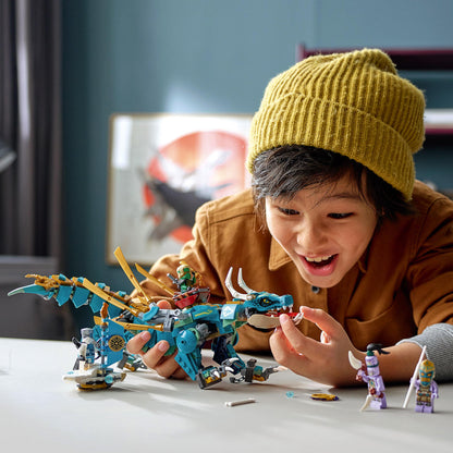 Child playing with LEGO® NINJAGO Jungle Dragon set 71746, smiling and interacting with the dragon and minifigures.