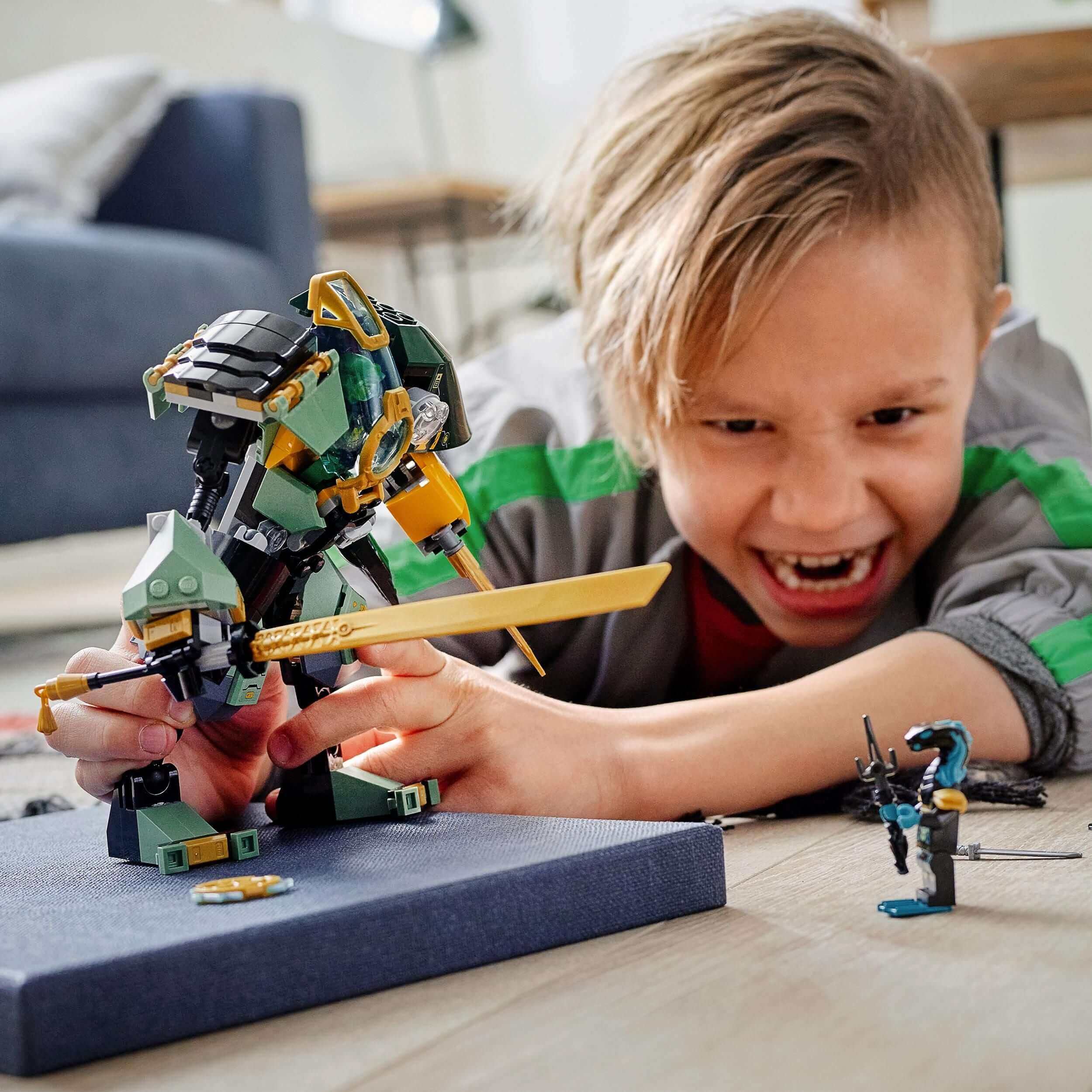 Child enjoying playtime with LEGO® NINJAGO Lloyd’s Hydro Mech toy, featuring minifigures and underwater action.