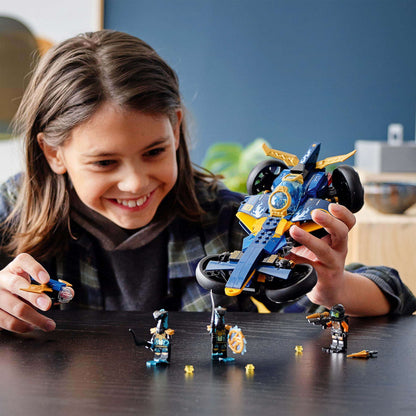 Child enjoying playtime with LEGO NINJAGO Ninja Sub Speeder Car Toy 71752 and minifigures on a table.
