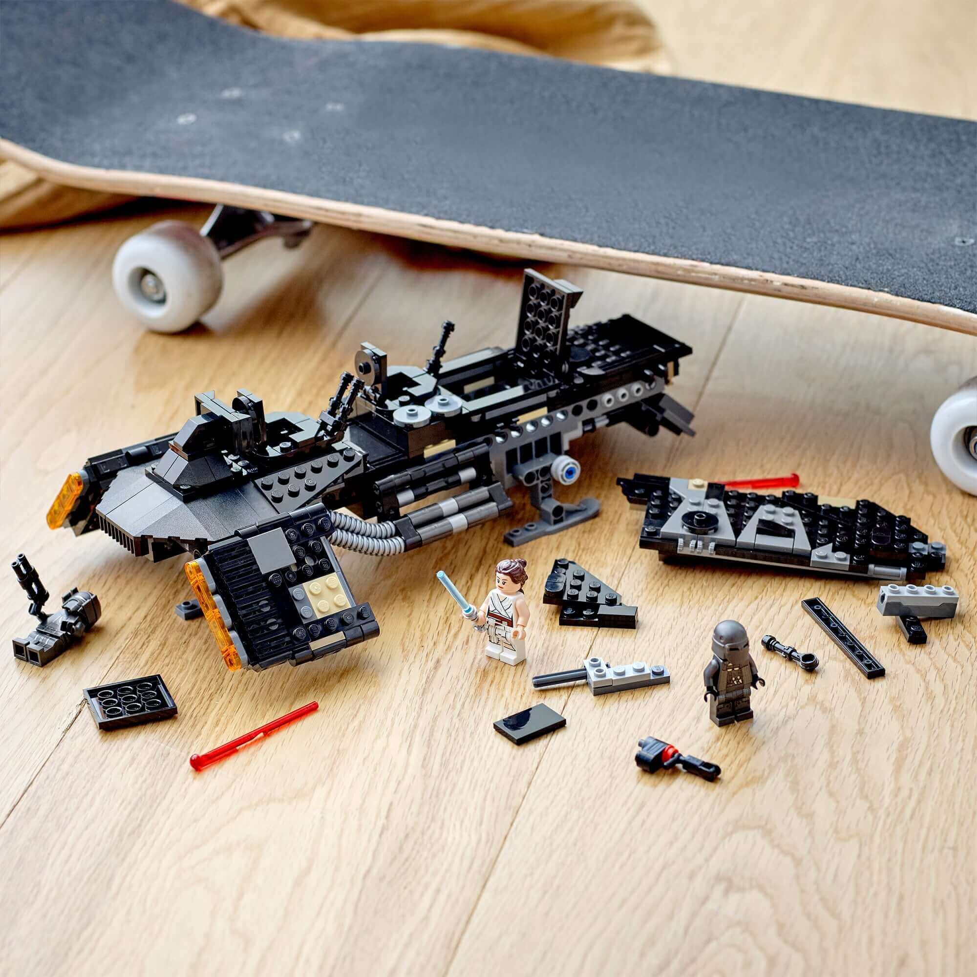 LEGO Star Wars Knights of Ren Transport Ship 75284 building set with mini figures and accessories on a wooden floor.