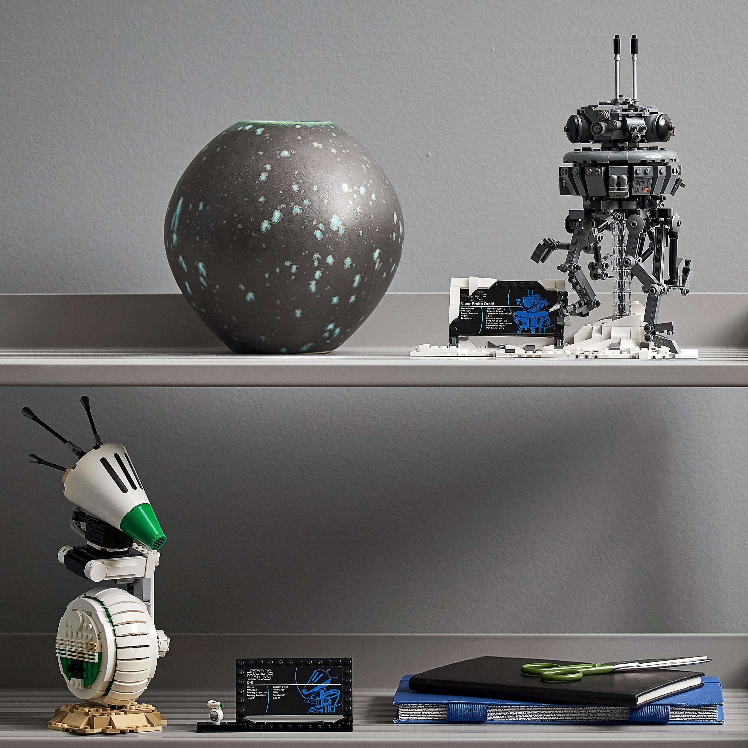 LEGO Star Wars Imperial Probe Droid set displayed on a shelf alongside a decorative vase and office supplies.