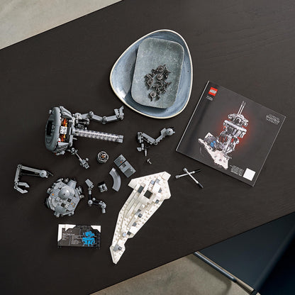 LEGO® Star Wars Imperial Probe Droid 75306 set components on a table, showcasing build pieces and instruction manual.