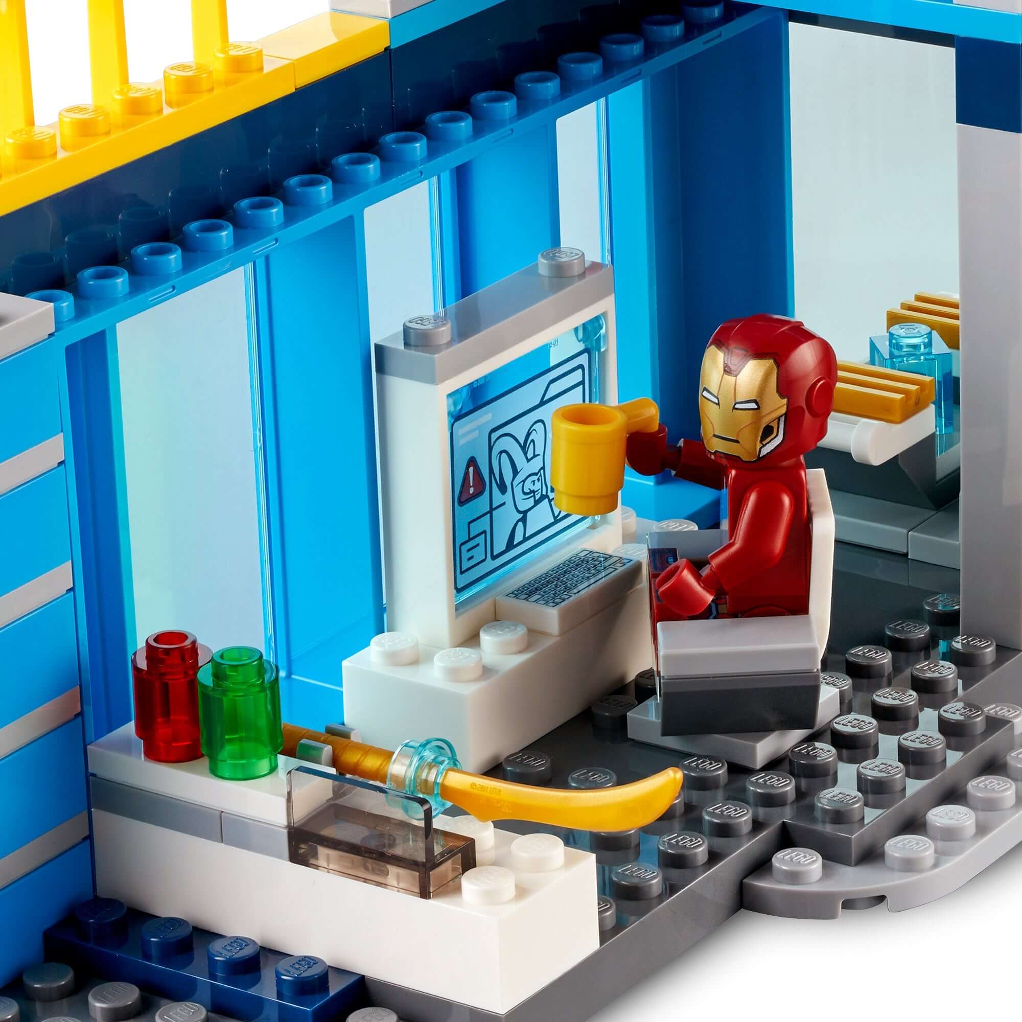 LEGO Marvel Avengers set with Iron Man at a computer, showcasing imaginative superhero role-play.
