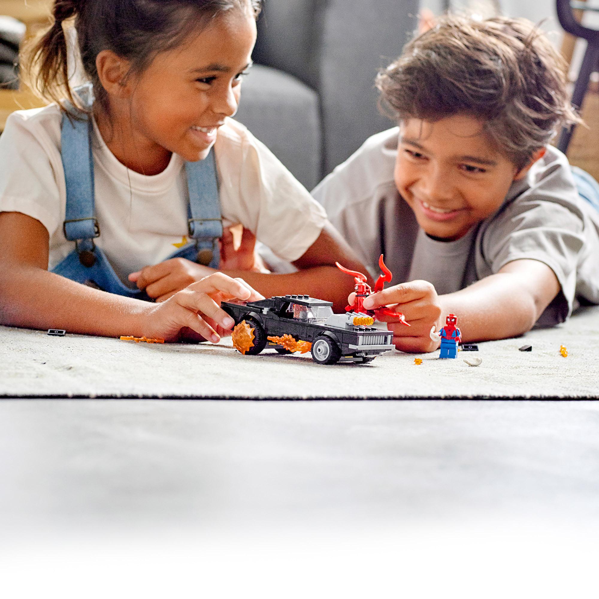 Kids playing with LEGO Marvel Spider-Man Ghost Rider and Carnage toy set, enjoying imaginative adventures on the floor.