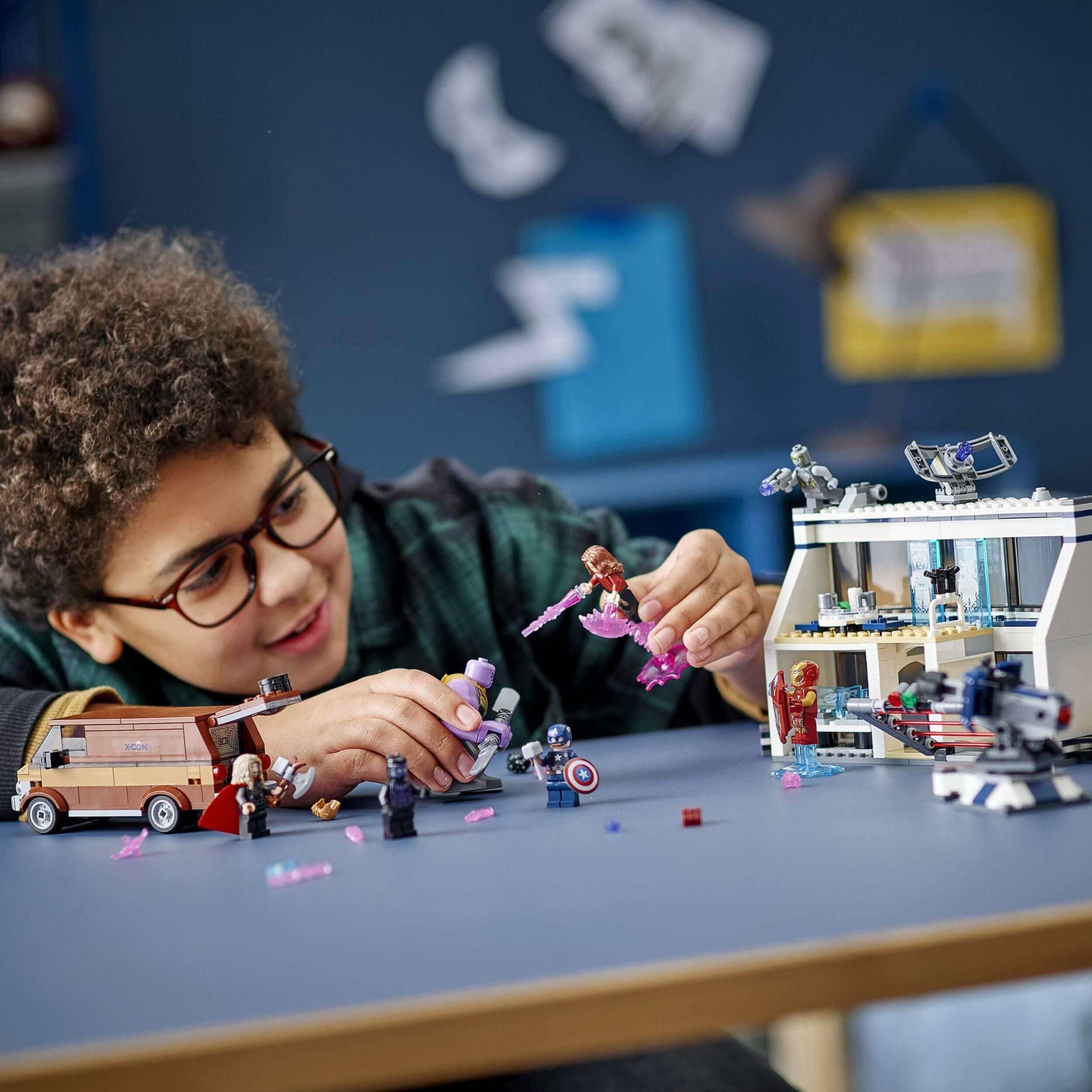 Child enjoying LEGO® Marvel Avengers: Endgame Final Battle Set 76192, creating superhero adventures with friends.