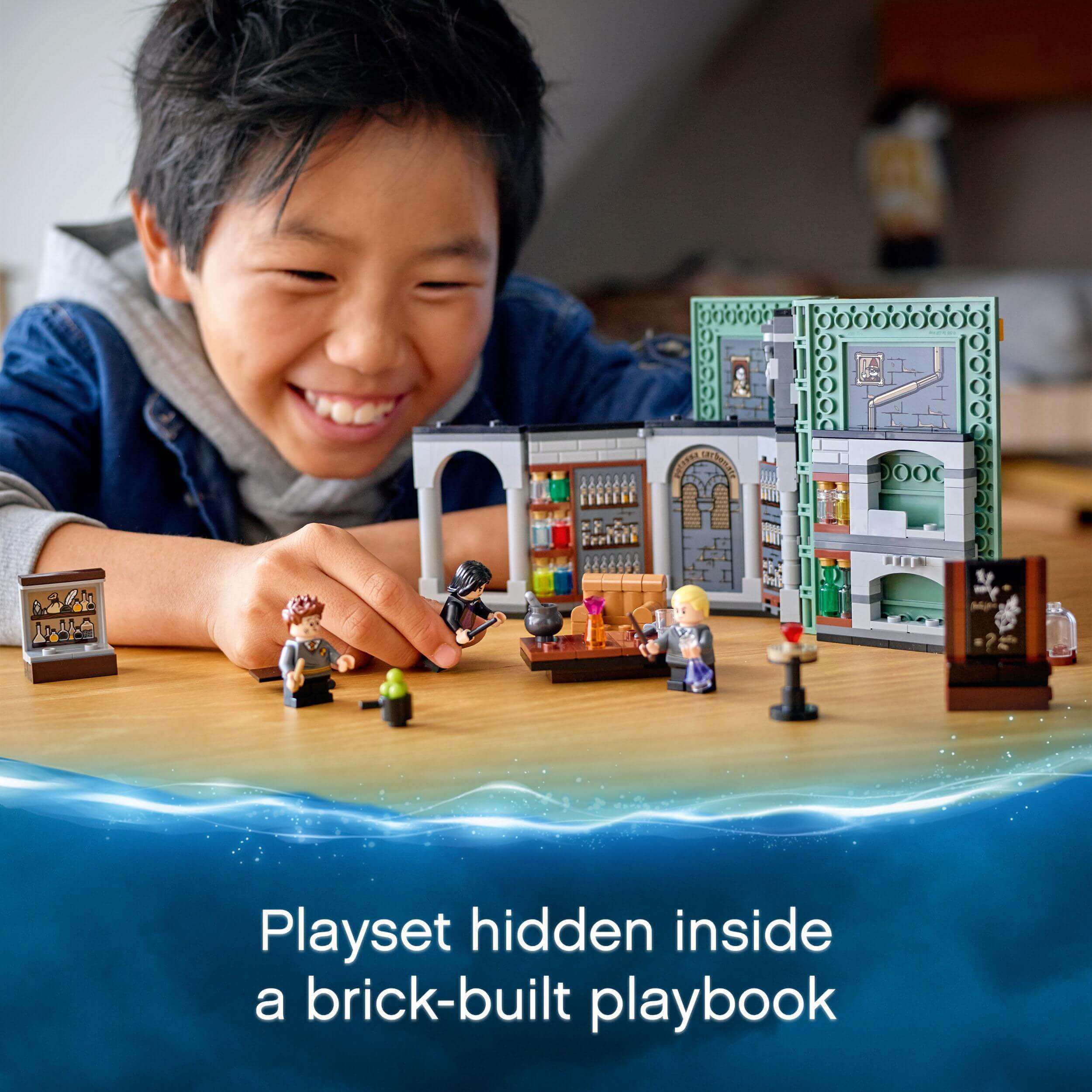Child enjoying LEGO Harry Potter Potions Class playset inside a magical brick-built book.