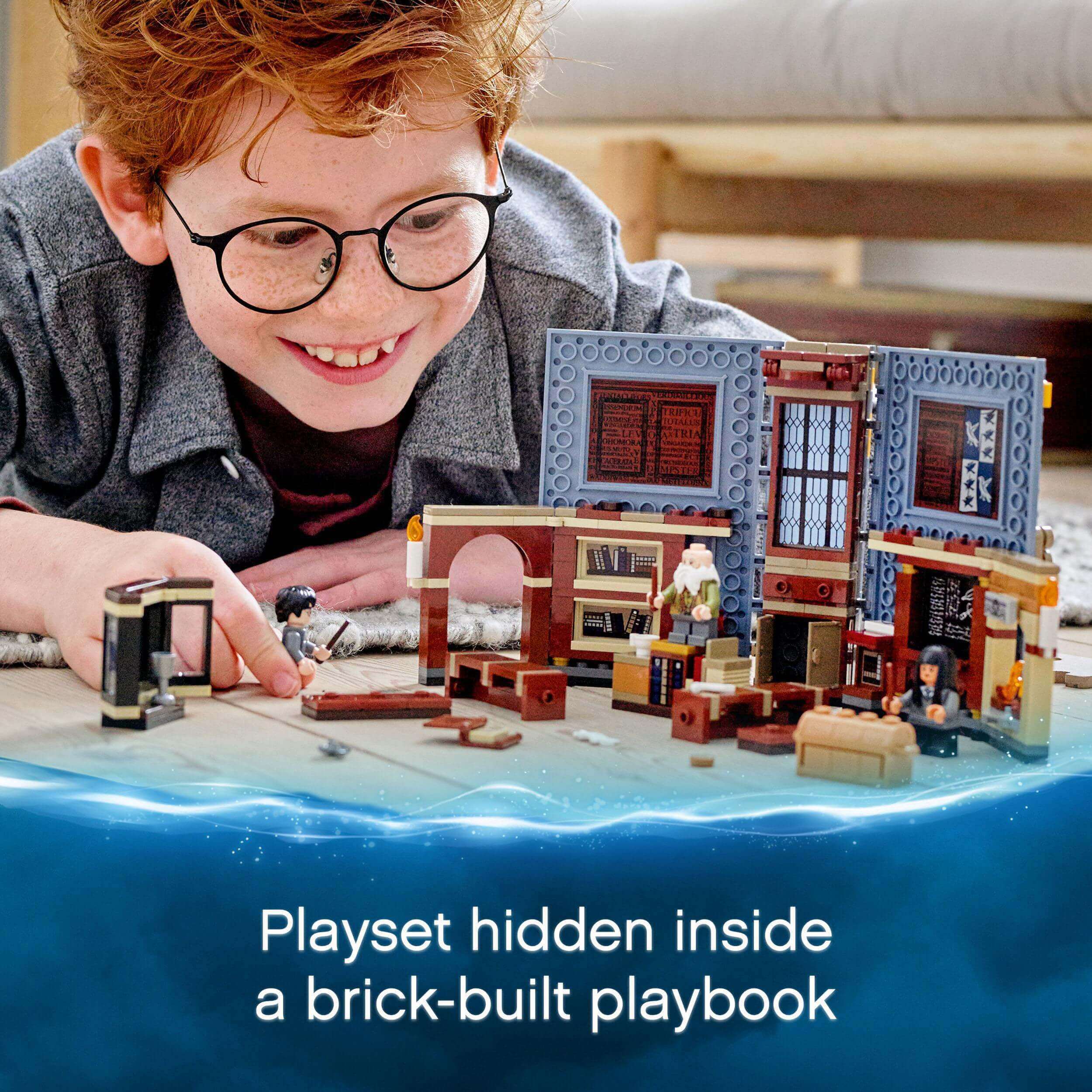 Child playing with LEGO® Harry Potter Hogwarts Charms Class Set 76385, showcasing the hidden classroom inside a playbook.