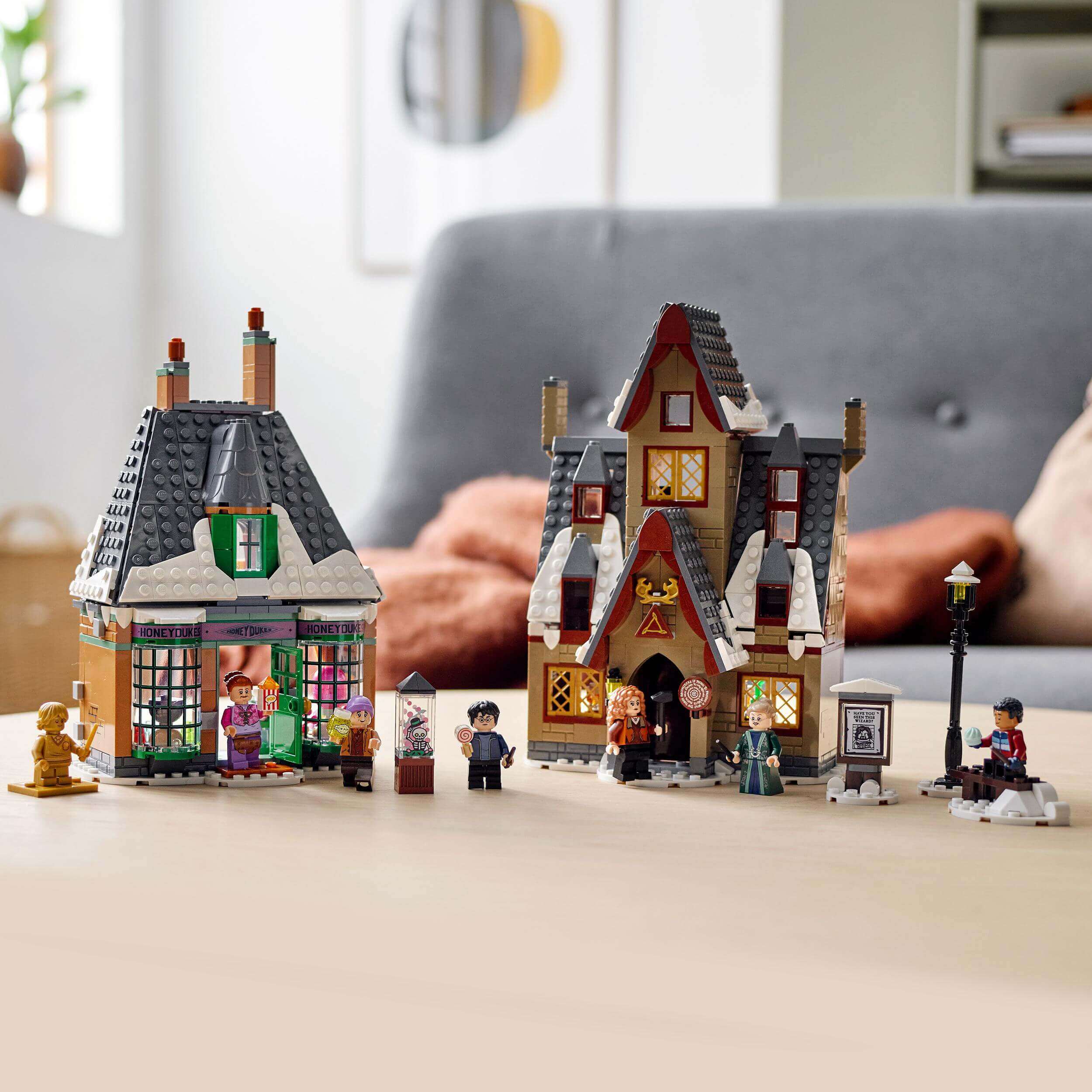 LEGO Harry Potter Hogsmeade Village Visit Set 76388 featuring colorful buildings and characters in a magical setting.