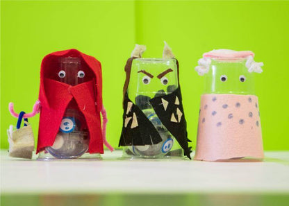 Three crafted characters using plastic cups, felt, and googly eyes, showcasing creativity with the Sphero Craft Pack.