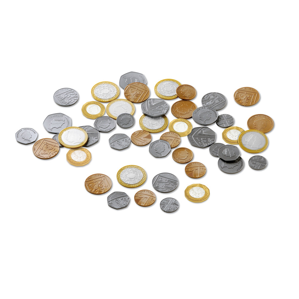 A studio shot of 700 realistic plastic UK coins, including 1p, 2p, 5p, 10p, 20p, 50p, £1, and £2 denominations. The coins feature updated tails artwork and the 12-sided 2017 £1 design.