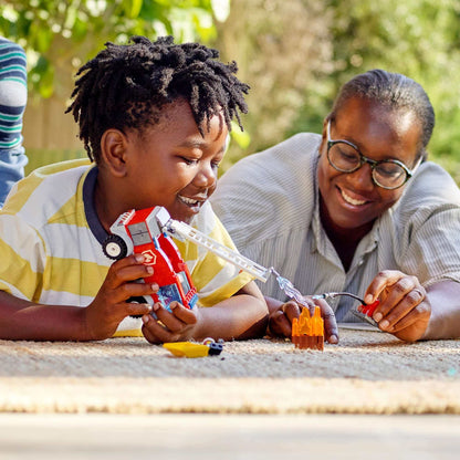Child and adult play with LEGO® City Fire Ladder Truck Toy 60280, enjoying a fun and creative building experience.