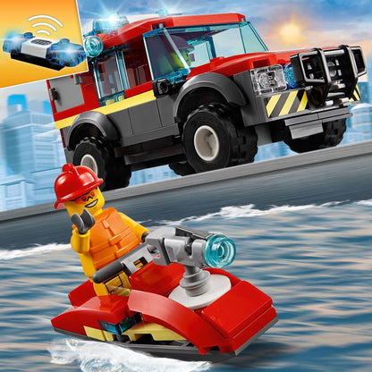 LEGO City Fire Station Truck 60215 with fireman on jet ski, bright colors and urban background, dynamic play scene.