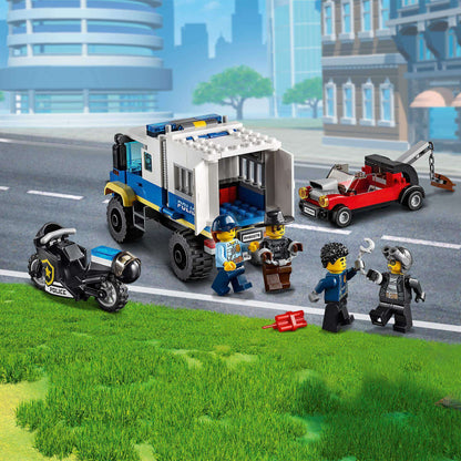 LEGO® City Police Prisoner Transport Truck 60276 with minifigures and vehicles for imaginative play.