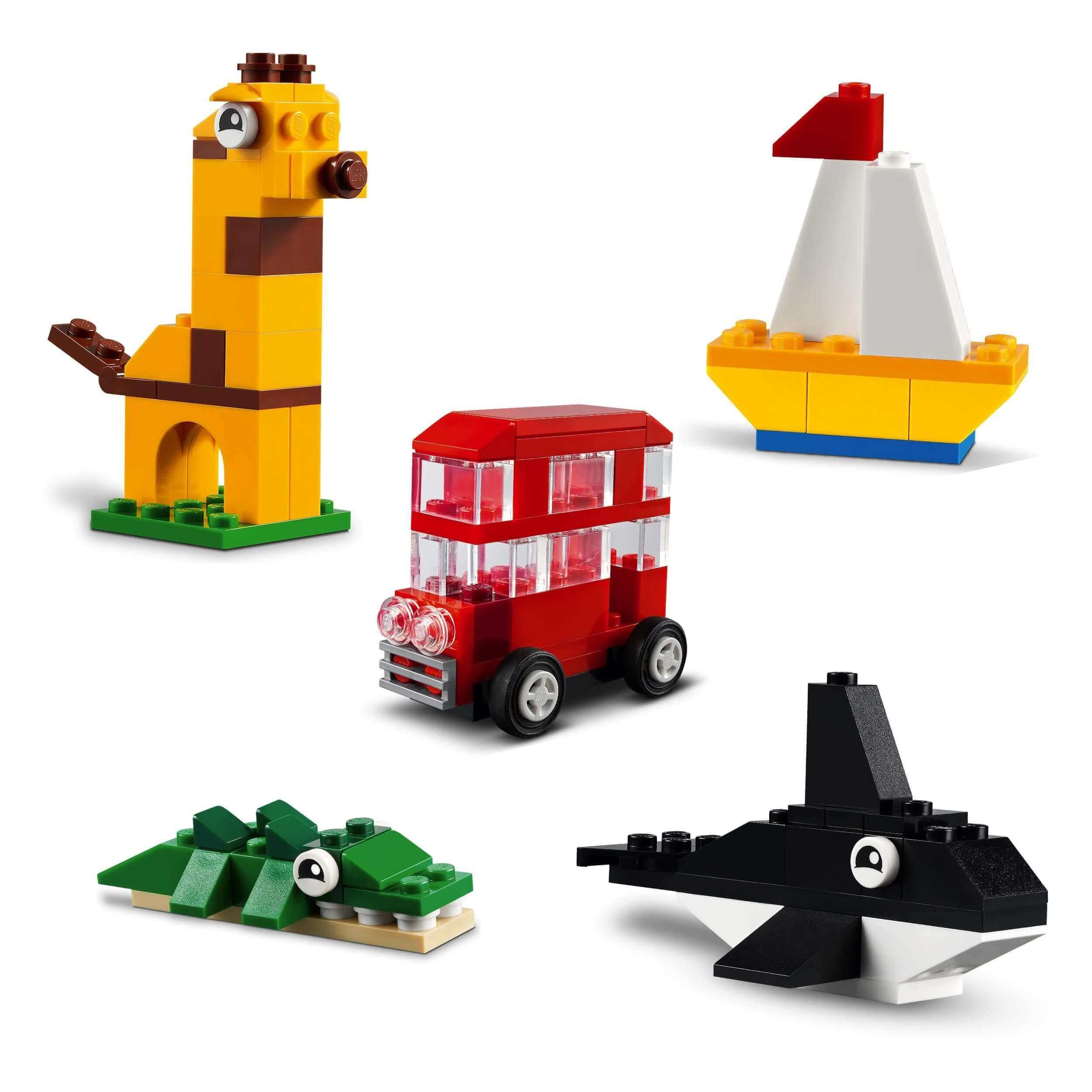 LEGO Classic Around the World Bricks Set 11015 including a giraffe, car, sailboat, crocodile, and whale.