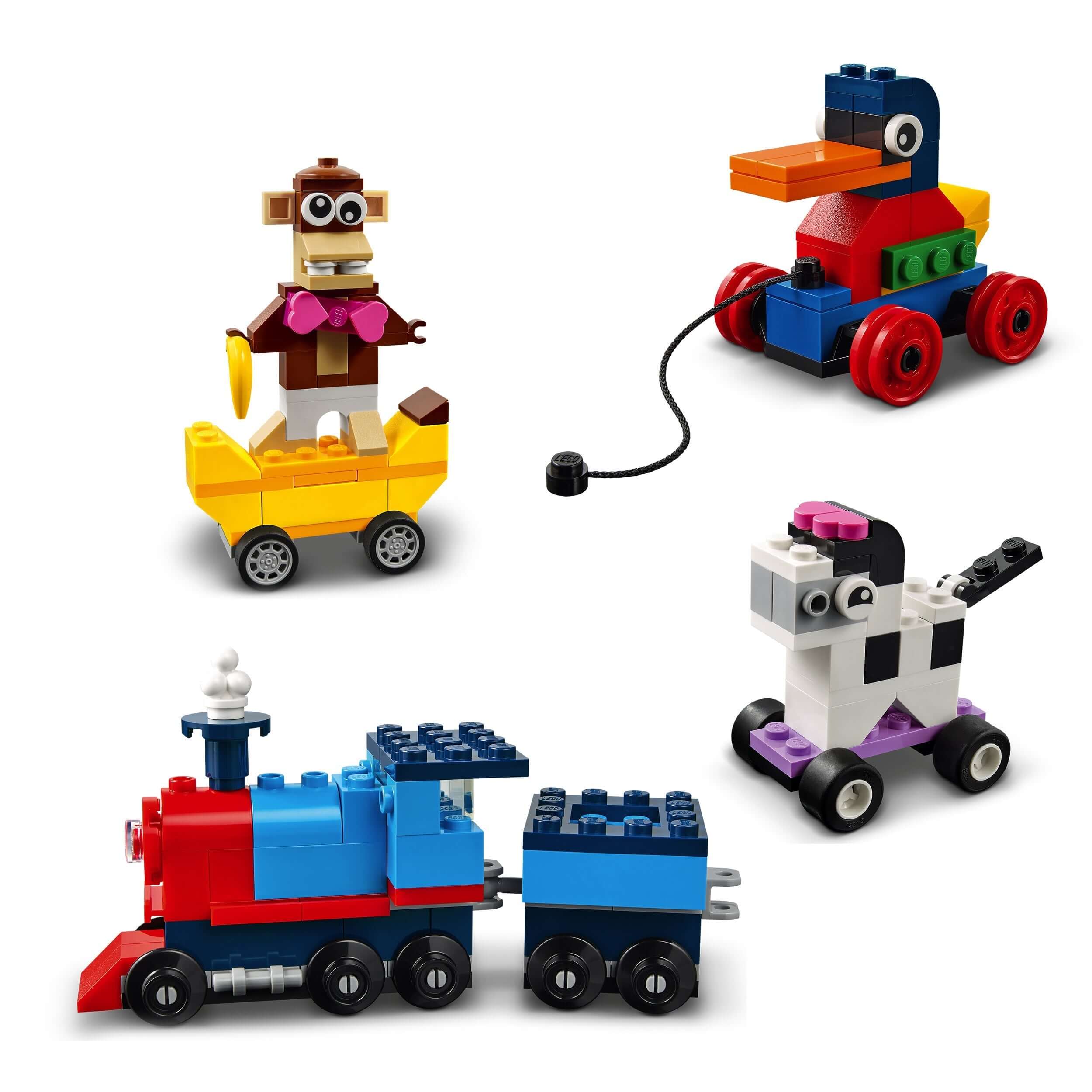 Colorful LEGO® Classic Bricks and Wheels playset with a monkey, duck, train, and cow models for creative building.