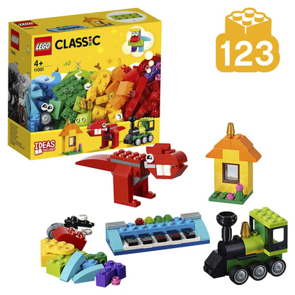 LEGO Classic Bricks and Ideas Construction Toy 11001 with colorful pieces, dinosaur, house, and train model.