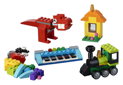 Colorful LEGO® Classic Bricks set featuring a dinosaur, house, piano, and train for creative building fun.