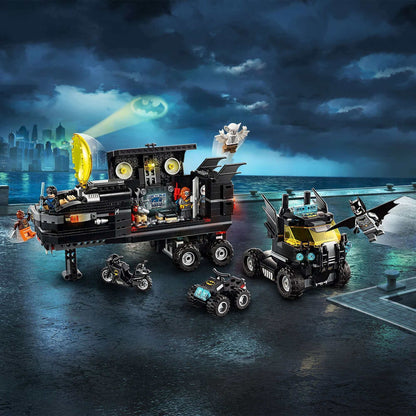 LEGO DC Batman Mobile Bat Base Truck with vehicles, gadgets, and 6 minifigures set against a city skyline.