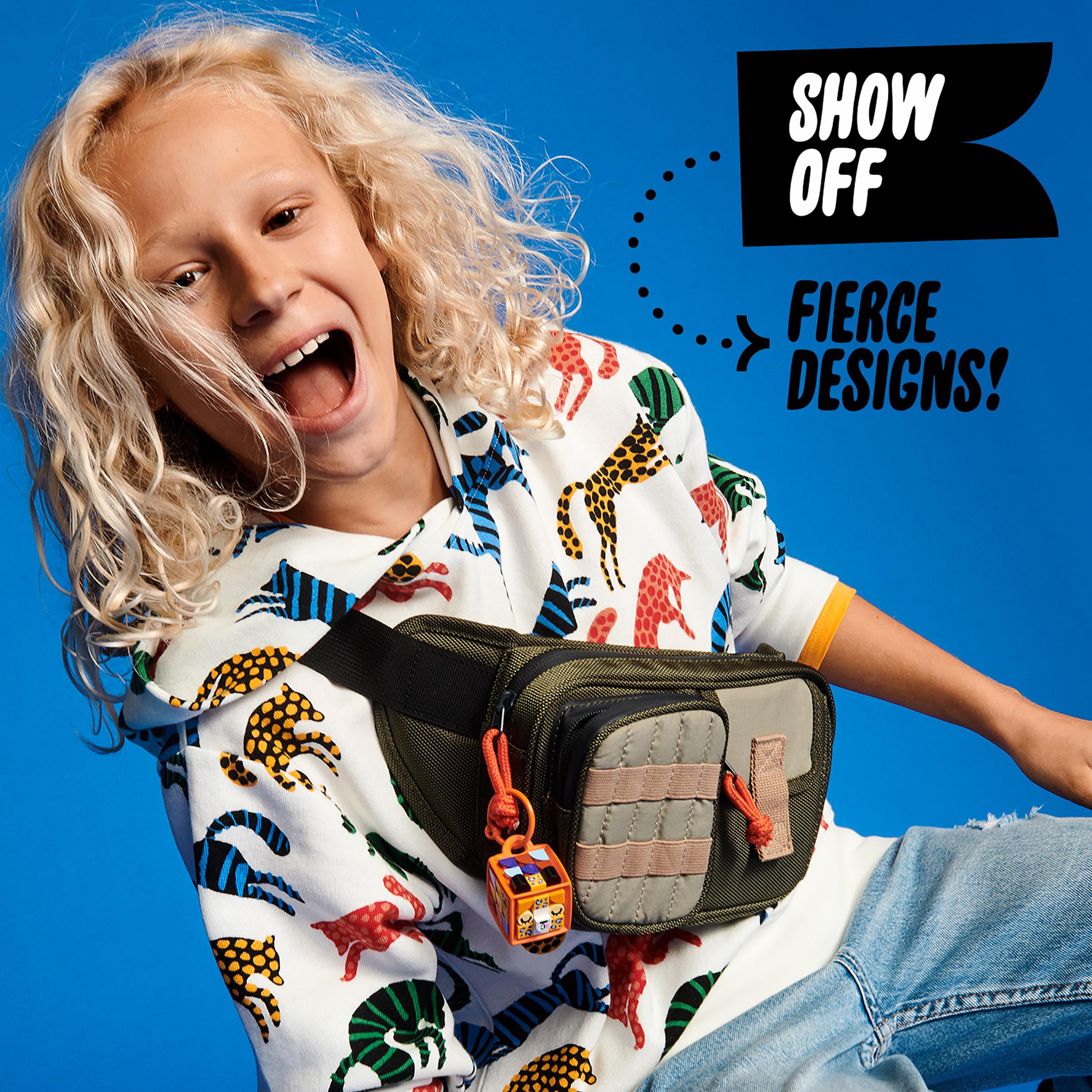 Child joyfully wearing a colorful bag showcasing LEGO® DOTS Bag Tag Leopard Crafts Set 41929. Perfect for creative expression.