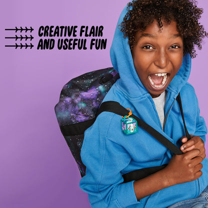 Child wearing blue hoodie with LEGO® DOTS narwhal bag tag on backpack, showcasing creativity and fun.