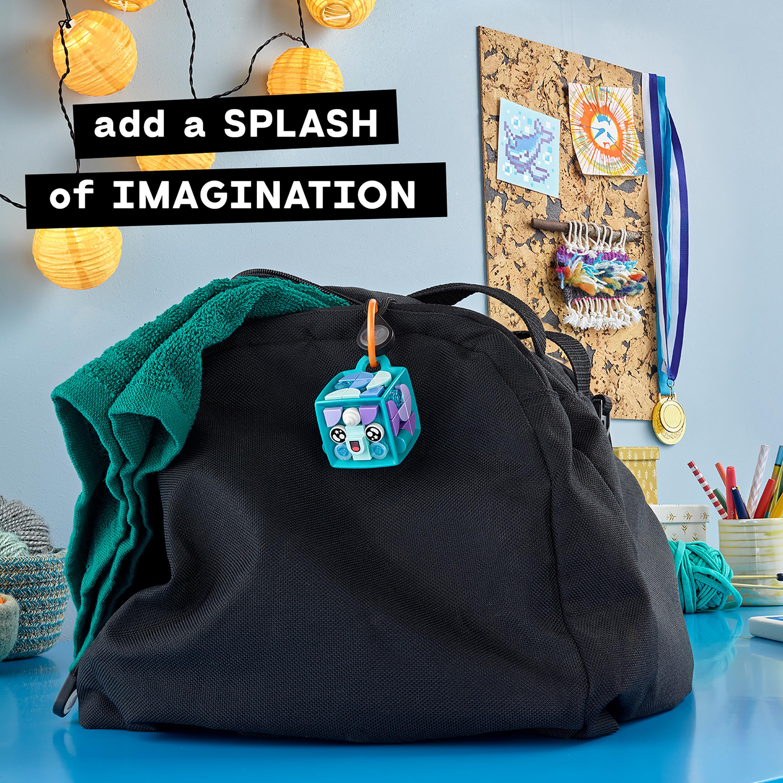 LEGO DOTS Narwhal bag tag kit hanging on a black backpack, promoting creativity and customizable accessories for kids.
