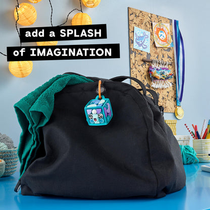 LEGO DOTS Narwhal bag tag kit hanging on a black backpack, promoting creativity and customizable accessories for kids.