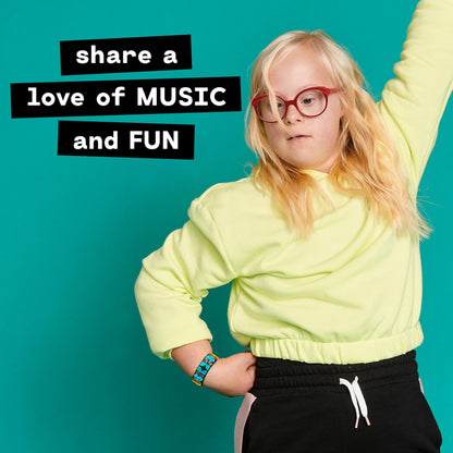 Child wearing a LEGO® DOTS Music Bracelet, showcasing creativity and fun in a vibrant setting.