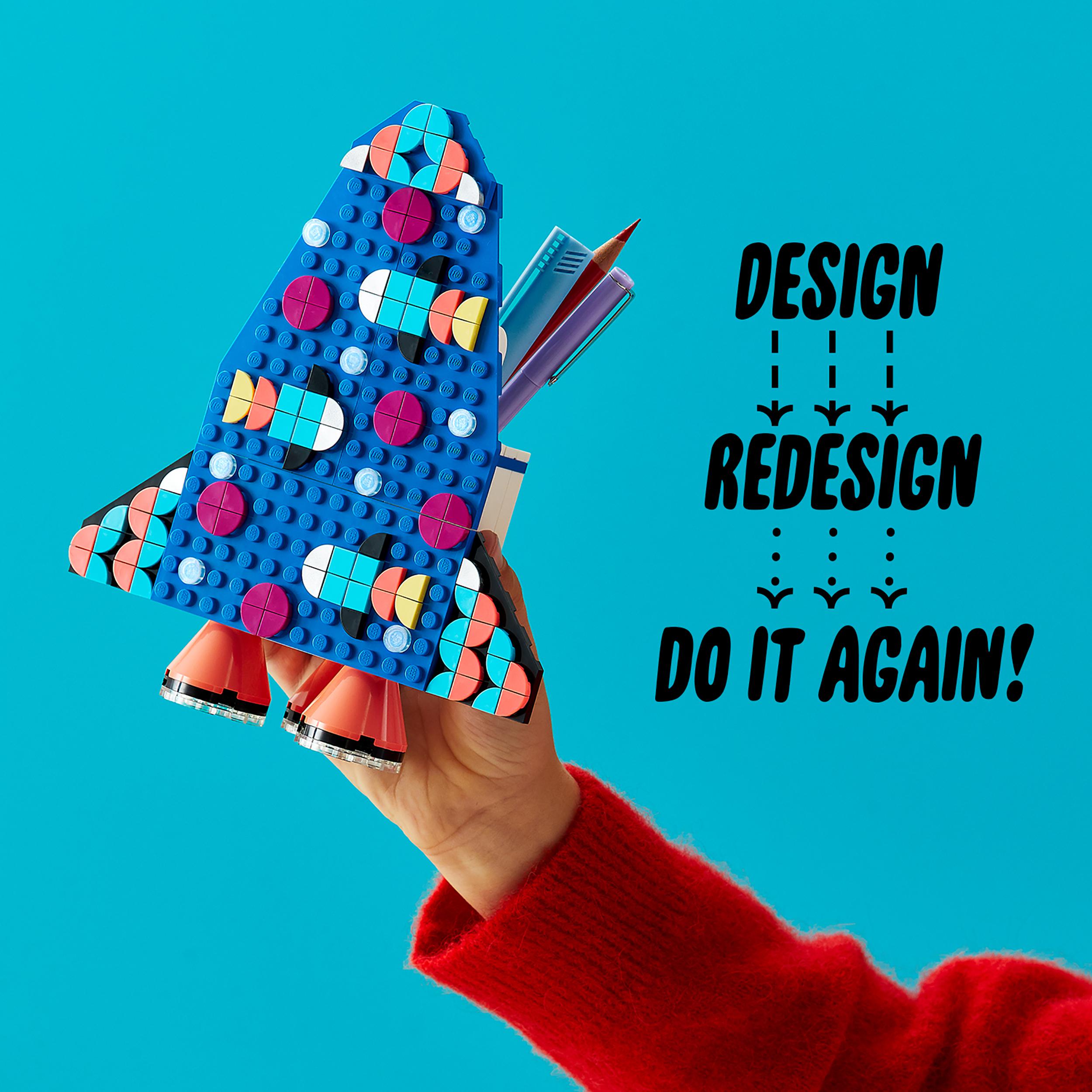 Colorful LEGO® DOTS rocket pencil holder craft set held by a child, featuring storage and display space for creative kids.