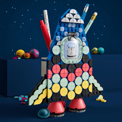 Colorful LEGO® DOTS Pencil Holder Craft Set designed as a rocket, great for organizing pencils and supplies for kids.
