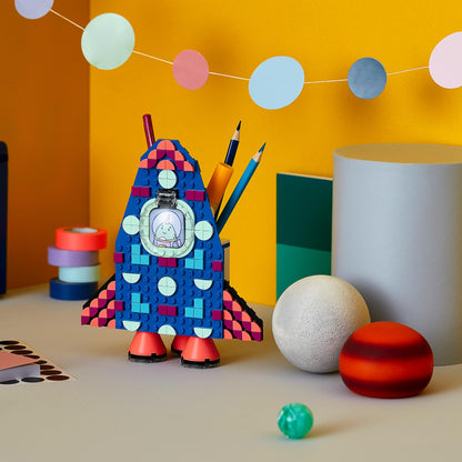 LEGO DOTS Pencil Holder Craft Set 41936, vibrant rocket design holding pencils, fun art and storage for kids.