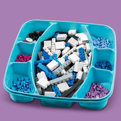 Colorful assortment of LEGO® DOTS tiles in a turquoise tray, perfect for creative room decor and secret holder projects.