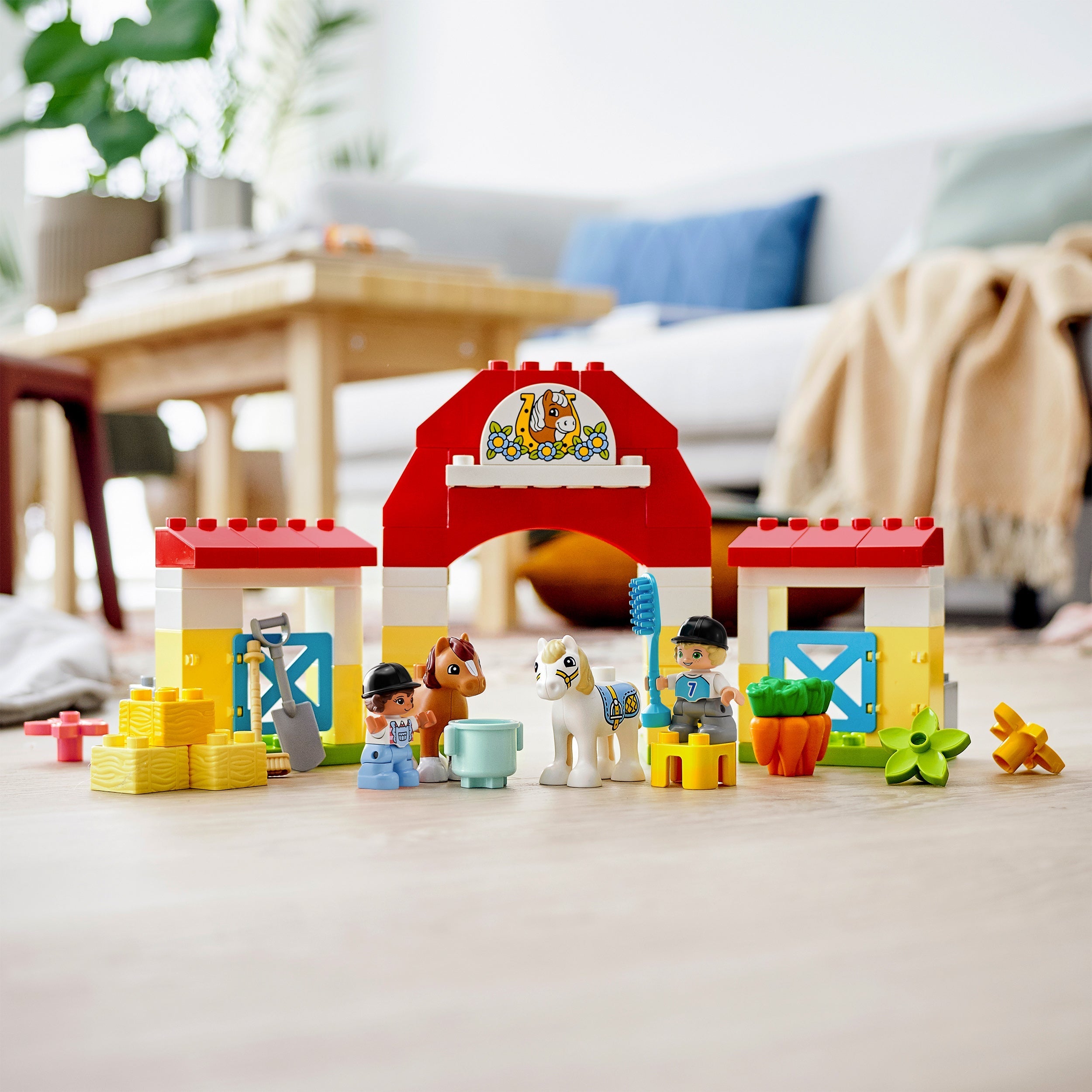 LEGO DUPLO Town Horse Stable with ponies, care accessories, and colorful building blocks for imaginative toddler play.