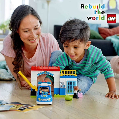 Child and parent playing with the LEGO® DUPLO Town Police Station Building Set 10902, featuring a police car.