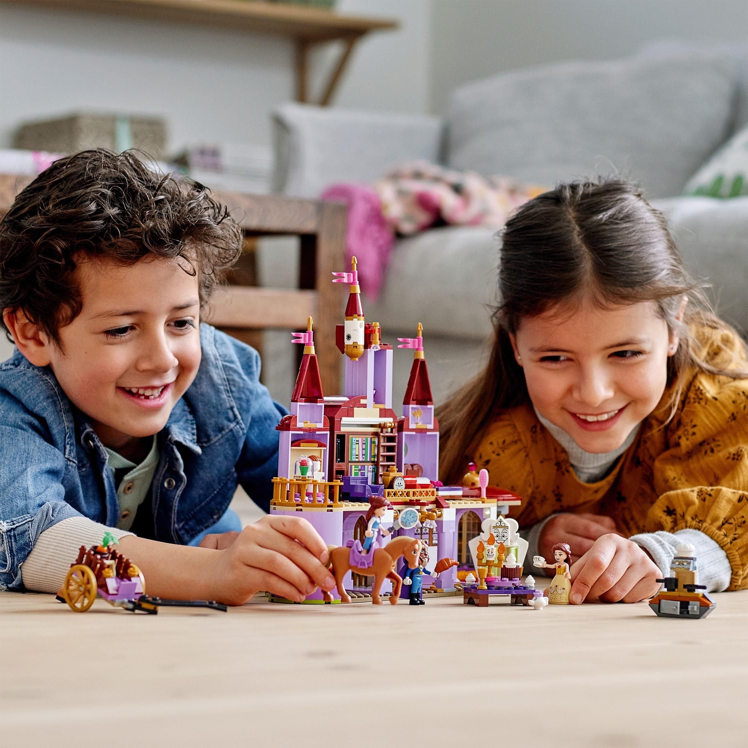 Kids enjoying LEGO® Disney Belle and the Beast’s Castle Set 43196, featuring a colorful castle and fun mini-doll figures.