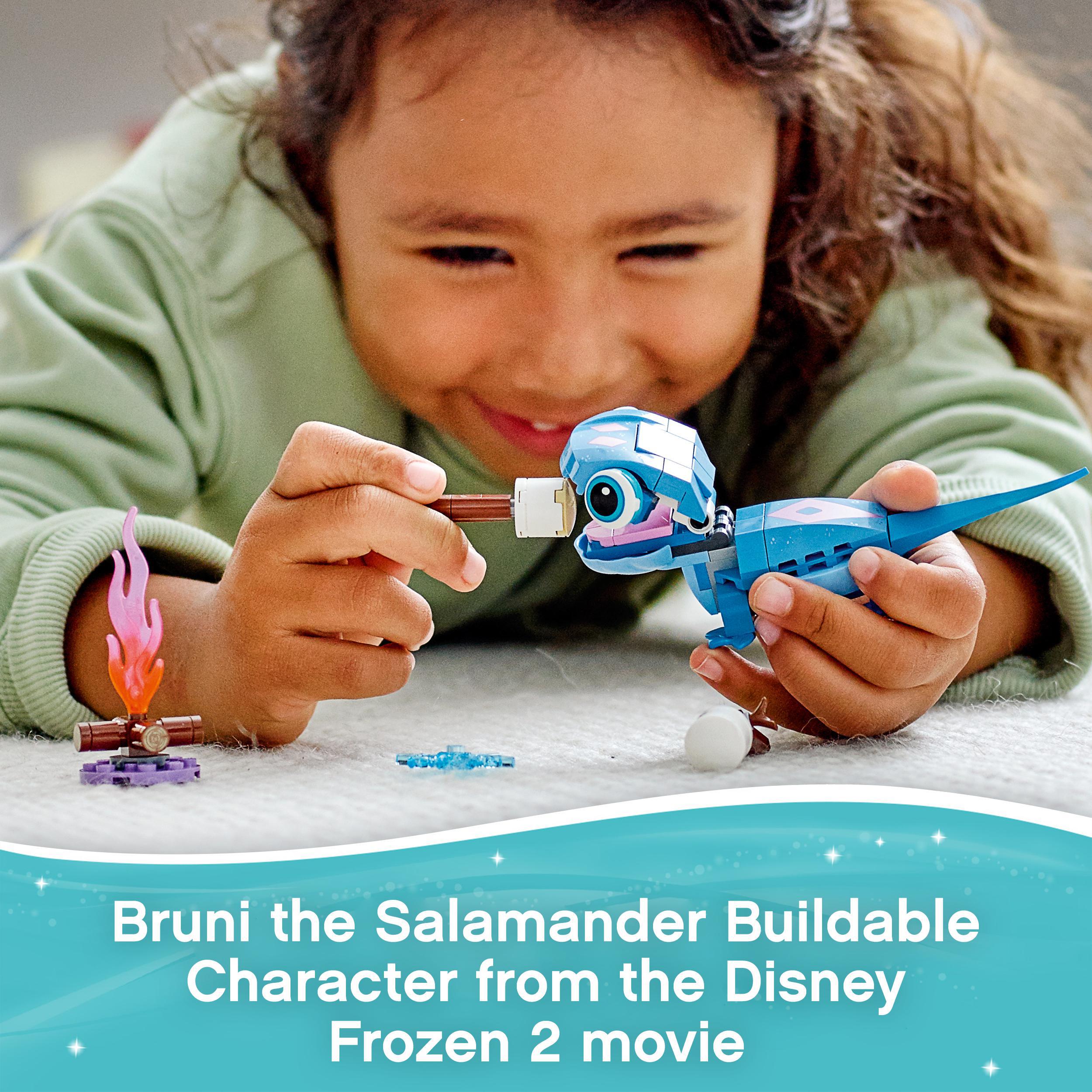 Child playing with LEGO® Bruni the Salamander from Disney Frozen 2, featuring a buildable character and fun accessories.