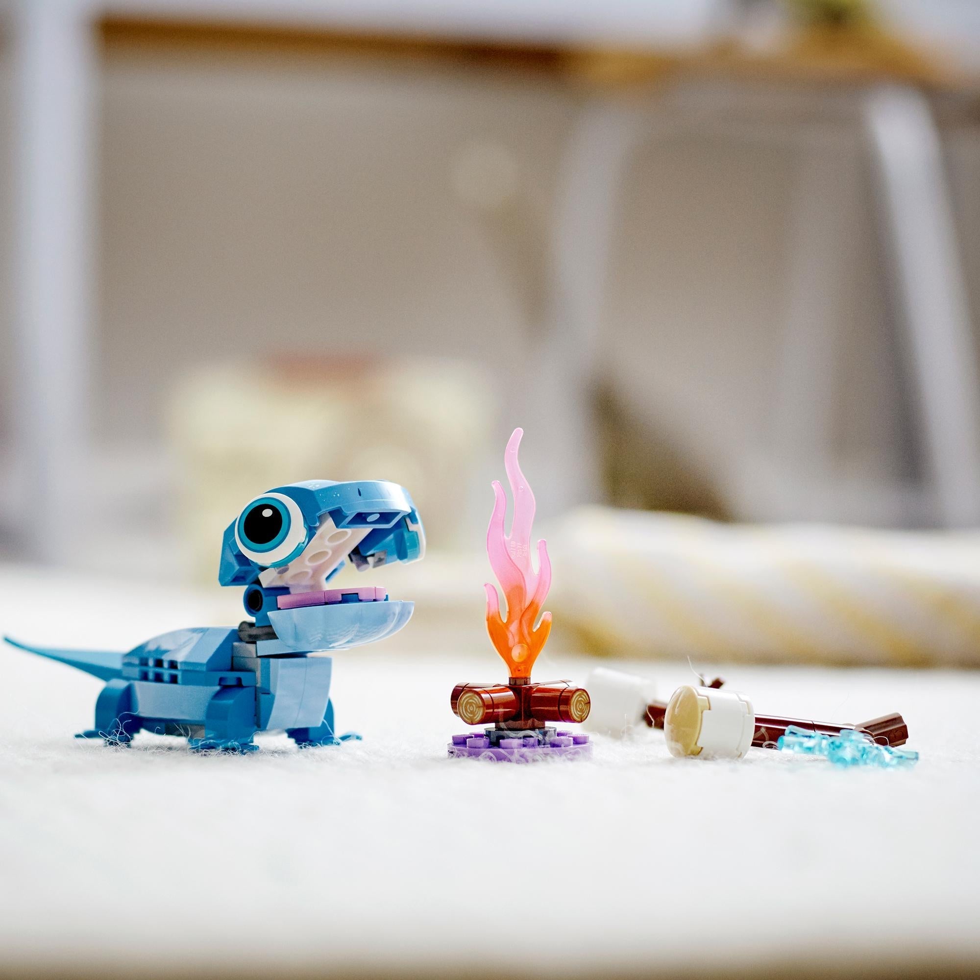 LEGO® Disney Frozen 2 Bruni the Salamander toy with campfire elements, perfect for imaginative play and storytelling.