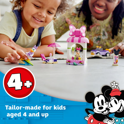 Kids enjoying LEGO® Disney Mickey Mouse Minnie Ice Cream Shop 10773, perfect for ages 4 and up with playful builds.