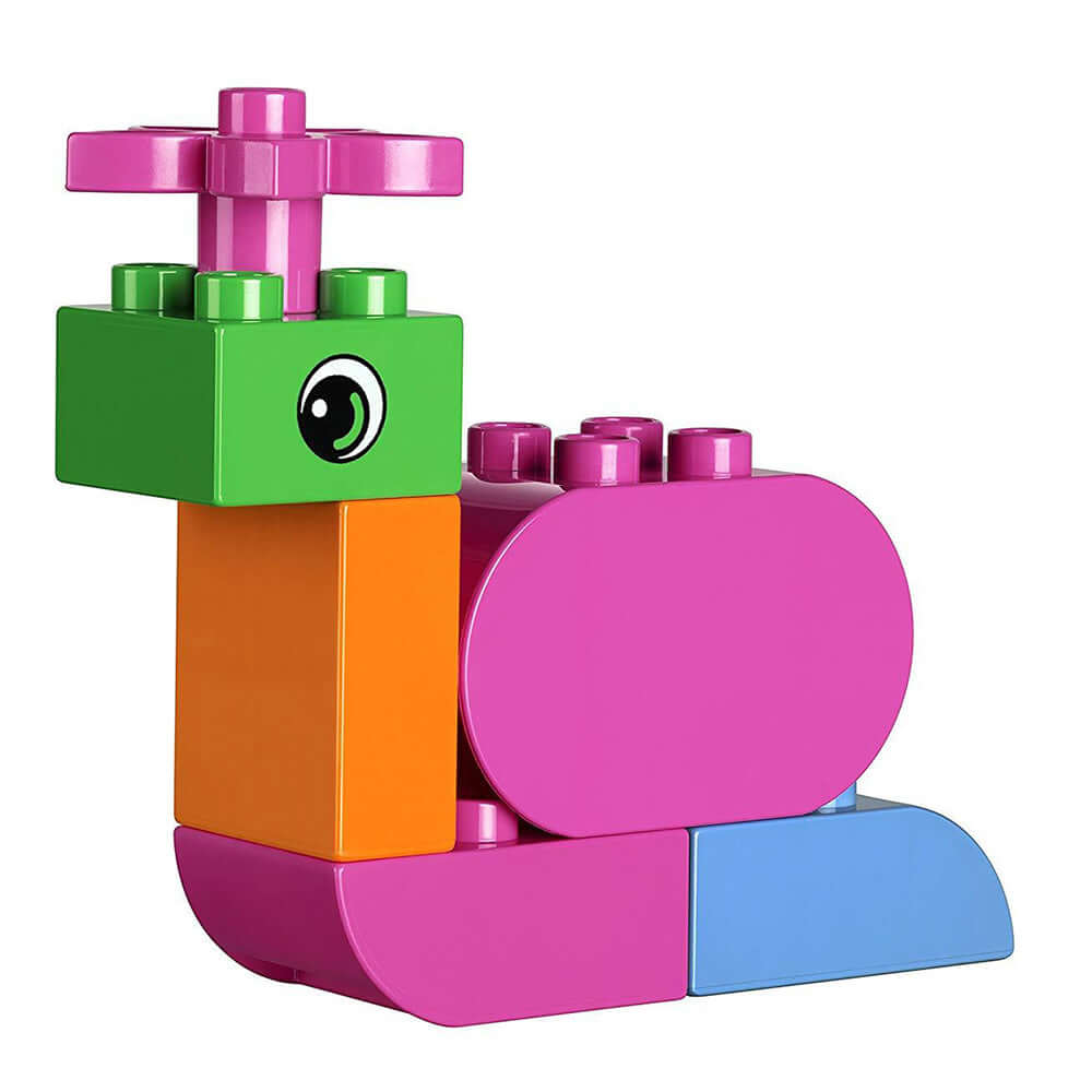 Colorful LEGO® Education animal model of a snail in pink, green, and orange, designed for collaborative play.