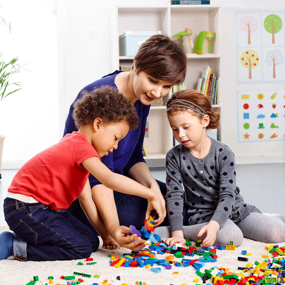 Children and adult enjoying creativity while building with LEGO® Education Creative Brick Set 45020.