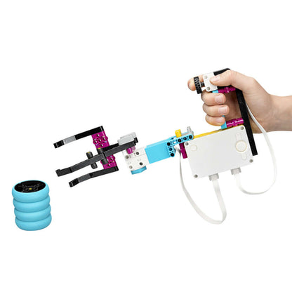 LEGO Education SPIKE PRIME Set 45678 showing a robotic hand grabbing a blue object, illustrating STEAM learning.