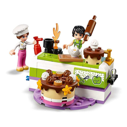 LEGO® Friends Baking Competition Playset 41393 featuring chefs decorating colorful cakes in Heartlake City.