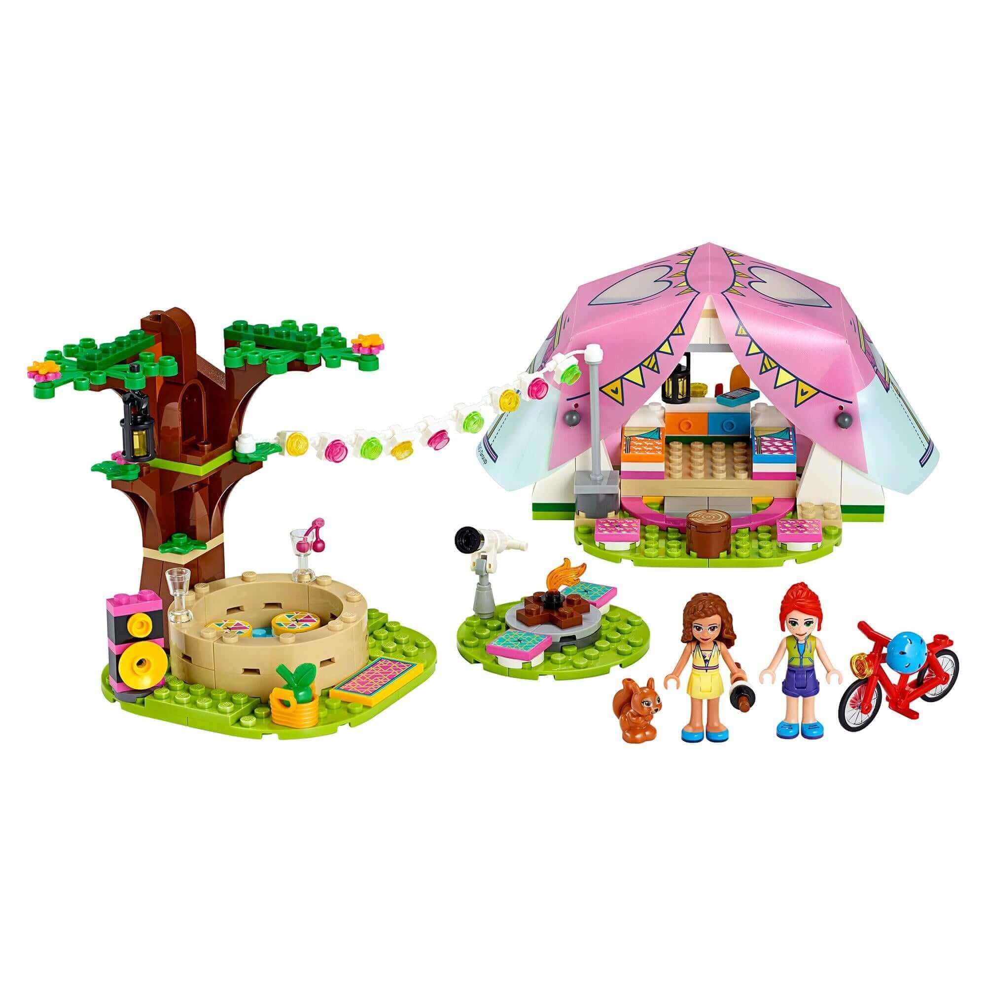 LEGO® Friends Nature Glamping Camping Set 41392 featuring tent, campfire, trees, and play figures for outdoor fun.