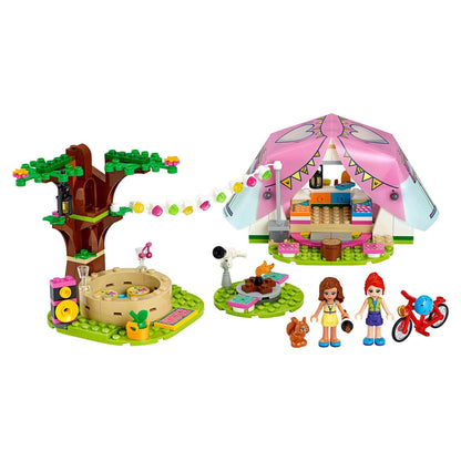 LEGO® Friends Nature Glamping Camping Set 41392 featuring tent, campfire, trees, and play figures for outdoor fun.