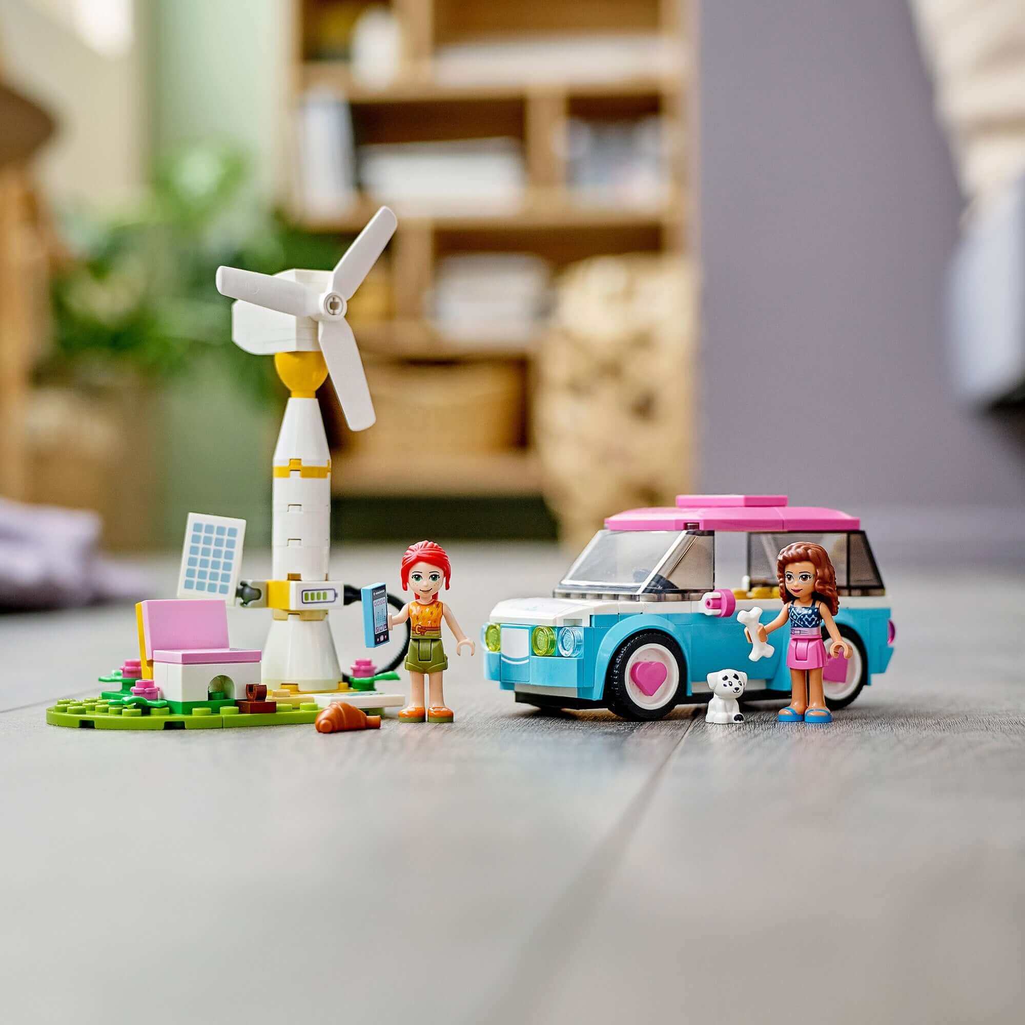 LEGO® Friends Olivia's Electric Car with charging station and mini dolls in a modern play setting.