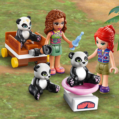 LEGO® Friends Panda Jungle Tree House playset with kids, pandas, and a weighing scale in a vibrant jungle setting.