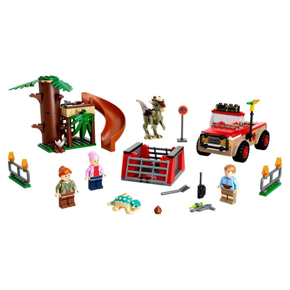 LEGO® Jurassic World Dinosaur Escape set 76939 featuring Stygimoloch, off-roader, tree house, and minifigures.