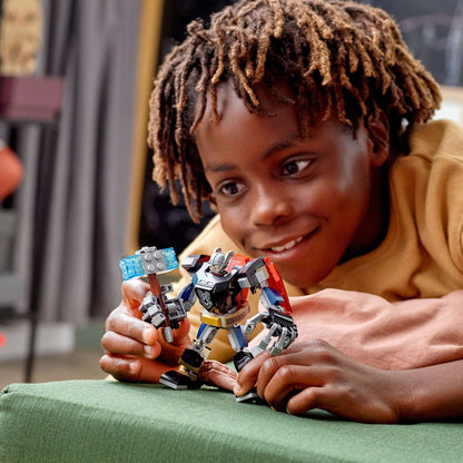 Child playing with LEGO Marvel Avengers Thor Mech Armour toy, showcasing its movable limbs and Thor minifigure.